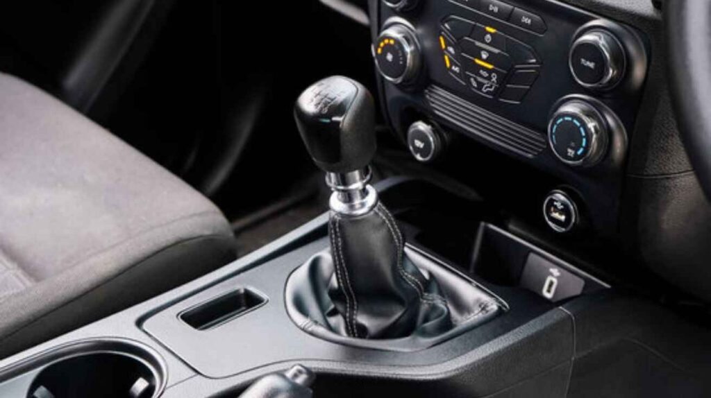Automatic car gear lever in Park position, showing safety lock for remote start.