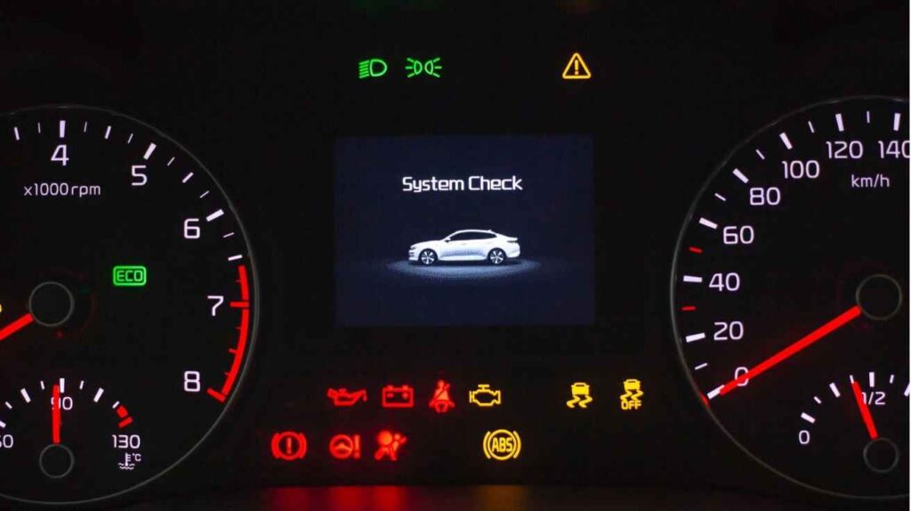 A car dashboard warning light in the background
