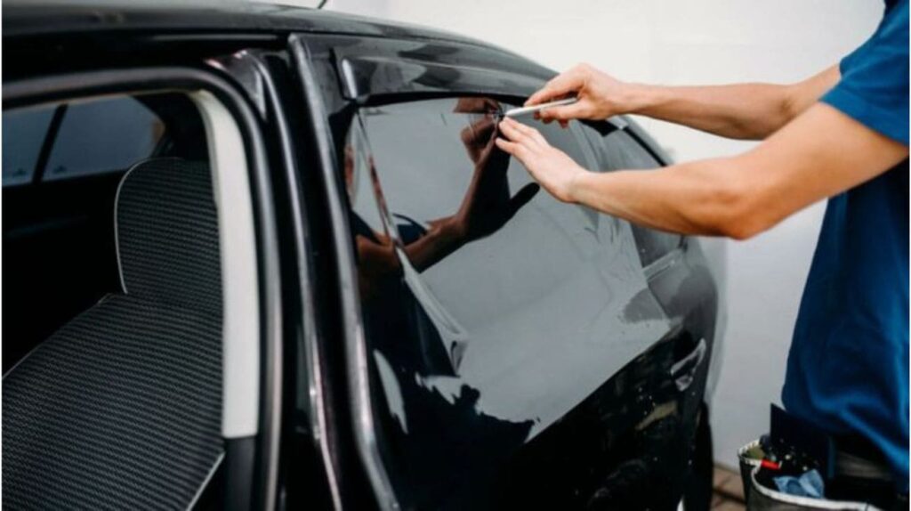A professional mechanic tinted car window symbolizing UV protection and interior comfort.